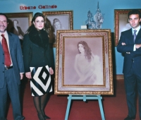 Paloma Cuevas, her husband the bullfighter Enrique Ponce and Urbano Galindo with her portrait at an exhibition of the artist